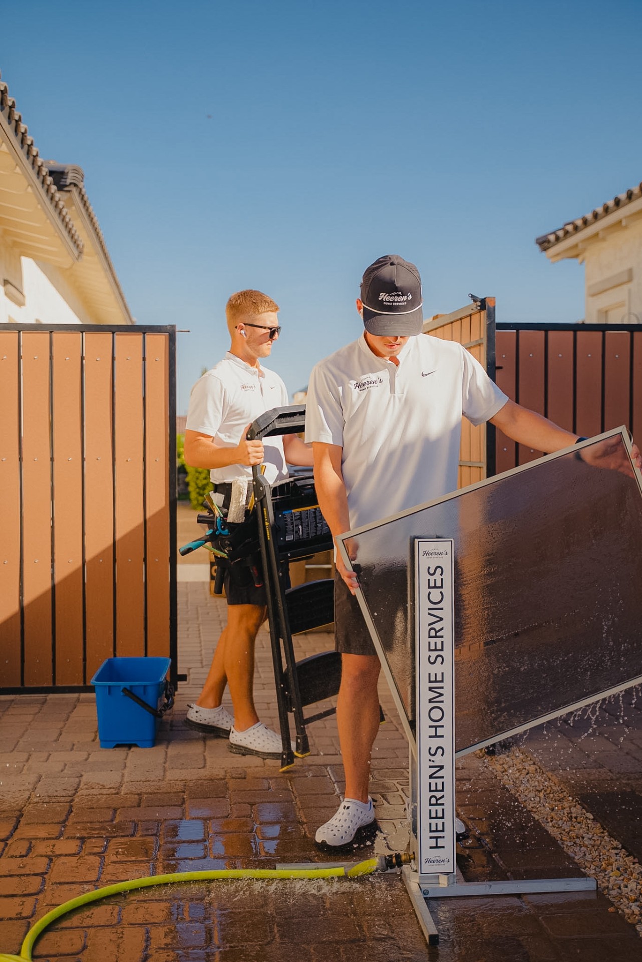 Heeren's Home Services team in front of a client home